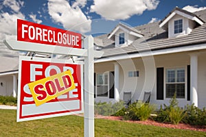 Sold Foreclosure Real Estate Sign and House - Left