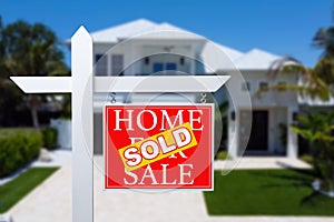 Sold Home For Sale Real Estate Sign in Front of Beautiful New House.