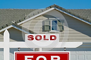 Sold Home For Sale Real Estate Sign and House