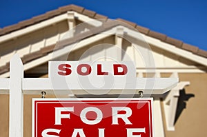 Sold Home For Sale Real Estate Sign and House