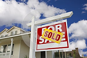 Sold Home For Sale Sign in Front of New House