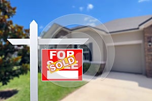 Sold Home For Sale Sign in Front of New House.