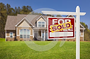 Sold Home For Sale Sign in Front of New House photo