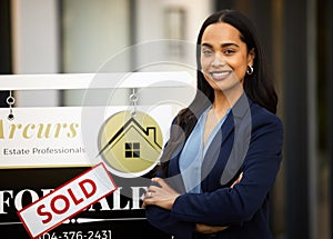 Sold, real estate and woman in portrait with arms crossed for home investment, property sale and agency. Happy face of