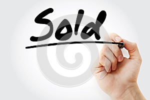 Sold text with marker, business concept background