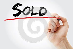 Sold text with marker, business concept background