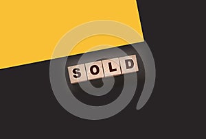 Sold Word Written In Wooden Cubes. Real estate business concept