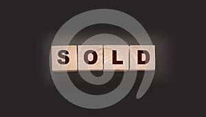 Sold Word Written In Wooden Cubes. Real estate business concept