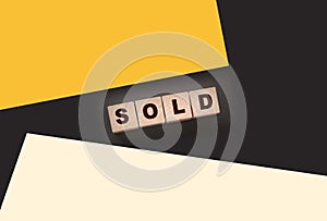 Sold Word Written In Wooden Cubes. Real estate business concept