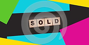 Sold Word Written In Wooden Cubes. Real estate business concept
