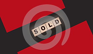 Sold Word Written In Wooden Cubes. Real estate business concept