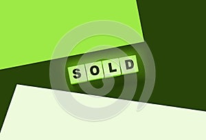 Sold Word Written In Wooden Cubes. Real estate business concept