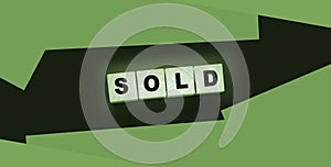 Sold Word Written In Wooden Cubes. Real estate business concept