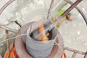 Soldering iron burn in tin bucket for steel welding work