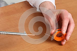 Soldering iron in his hand