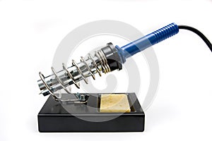 A soldering iron standing