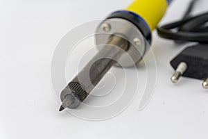 Soldering iron, on a white background. Soldering iron close-up. Electrical equipment repair concept