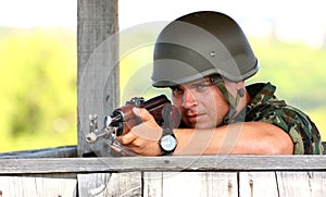 A soldier aiming