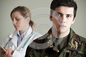 Soldier Being Assessed By Doctor photo