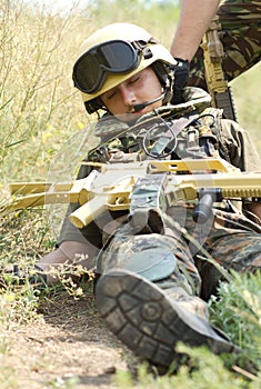 Soldier being draged away from a battledield