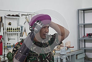 Soldier With Bionic Hand In Indonesia