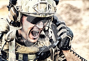 Soldier communicating with command during battle