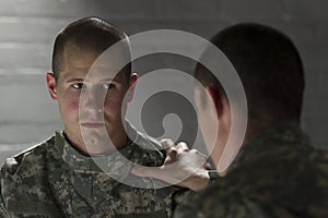 Soldier consoles peer with PTSD, horizontal