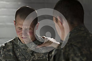 Soldier consoles peer with PTSD, horizontal