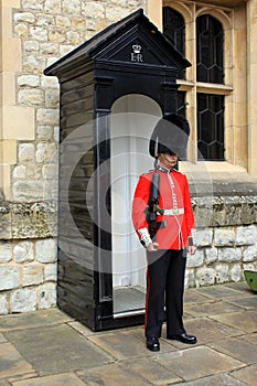 Soldier of English Guard patrols inside Tower of London in the service of the Queen of England