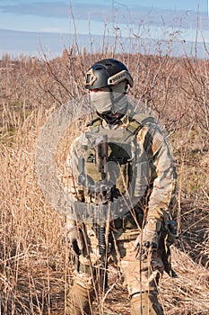 soldier in full NATO uniform posing in fields