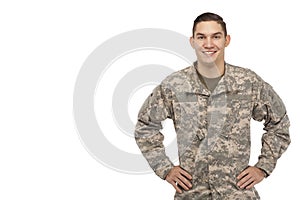 Soldier with hands on hips against white