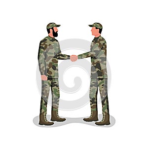 Soldier handshake. Two people in camouflage uniforms conclude a contract.