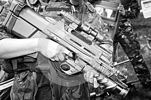 Soldier holding a machine gun in standing position