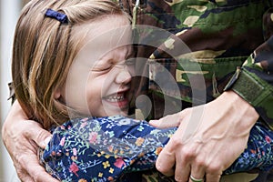 Soldier On Leave Being Hugged By Daughter