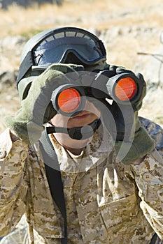 Soldier Looking Through Binoculars While Patrolling