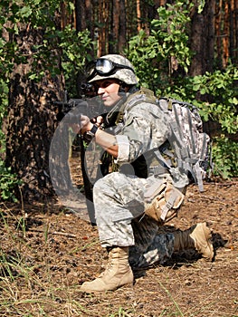 Soldier with M4 Carbine aiming photo