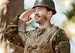 Soldier, military and man salute in nature for service, protection and battle training outdoors. War, national army and