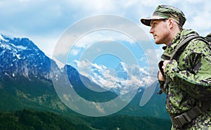 Soldier in military uniform with backpack hiking