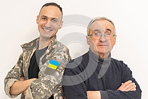 Soldier in military uniform reunited with his family and Ukrainian flag