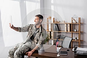 Soldier in military uniform using digital