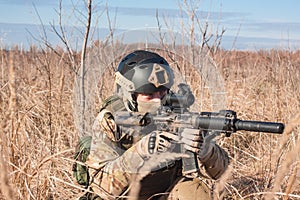 Soldier in NATO uniform aiming