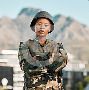 Soldier, portrait and black woman with arms crossed in city for power, confidence and mindset outdoors. War, combat and