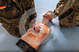 Soldier practices a medical training on a puppet