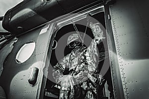 Soldier prepares to jump from a helicopter. The concept of computer games