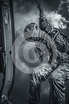 Soldier prepares to jump from a helicopter. The concept of computer games