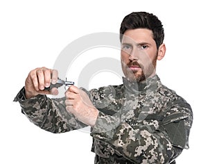 Soldier pulling safety pin out of hand grenade on white background. Military service