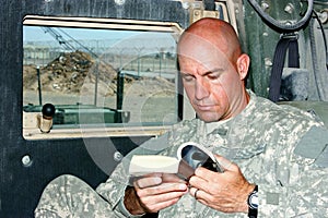 A soldier reading photo