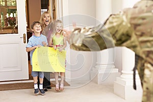 Soldier Returning Home And Greeted By Family