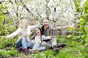 Soldier reunited with his family in park.