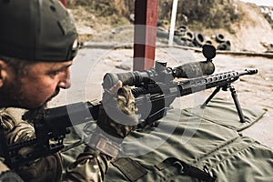 Soldier with rifle bfor shooting the target